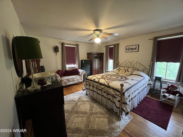 bedroom featuring ceiling fan and light hardwood / wood-style floors