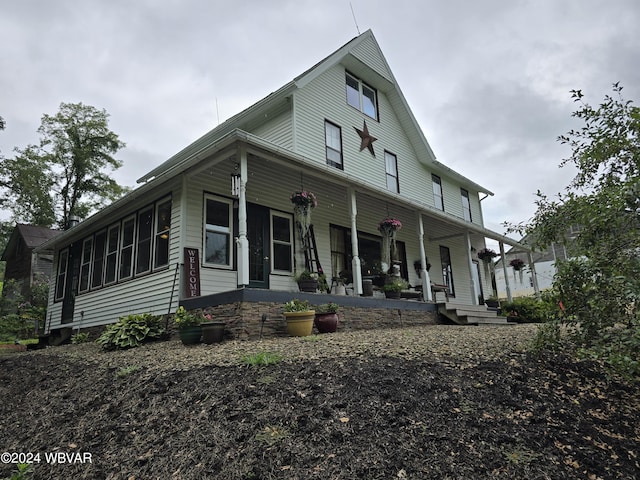 farmhouse-style home with covered porch