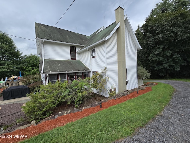 view of home's exterior featuring a yard