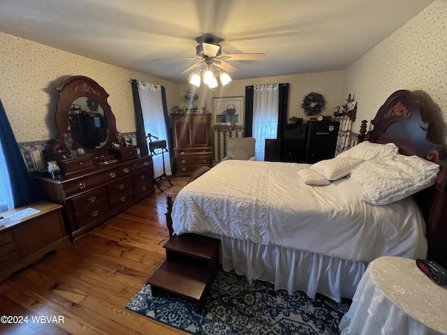 bedroom featuring wood-type flooring and ceiling fan