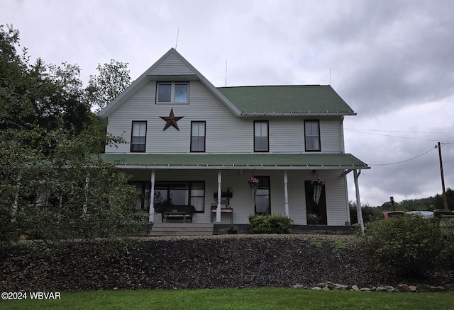 view of front of property featuring covered porch