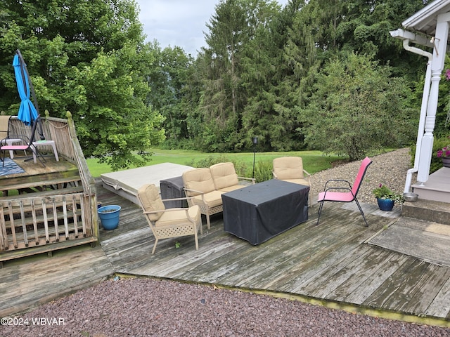 wooden terrace featuring an outdoor hangout area