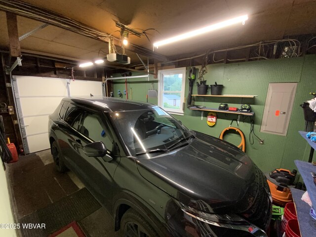 699 James St, Lock Haven, PA 17745 - garage featuring electric panel and a garage door opener
