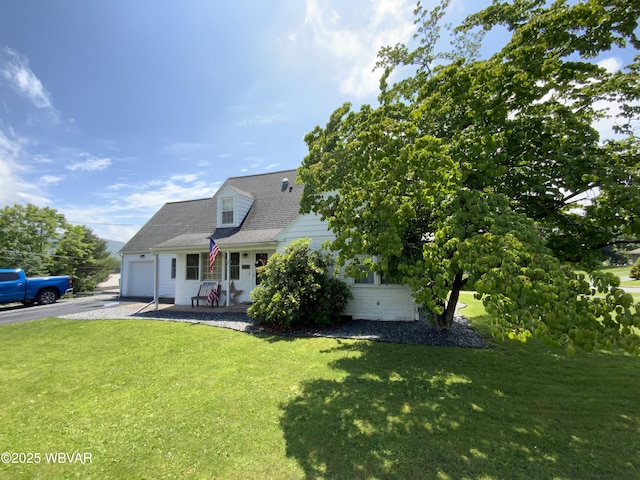 699 James St, Lock Haven, PA 17745 - cape cod home featuring a garage, driveway, and a front lawn