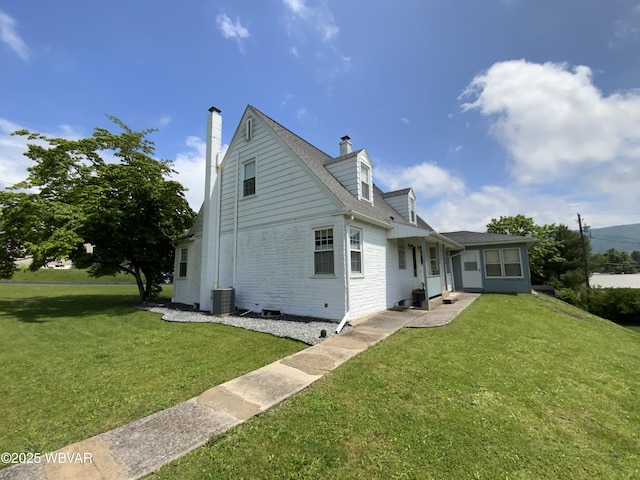 699 James St, Lock Haven, PA 17745 - rear view of property with central air condition unit, a chimney, a yard, and roof with shingles