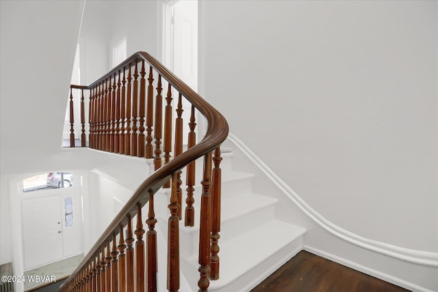 stairs with hardwood / wood-style floors