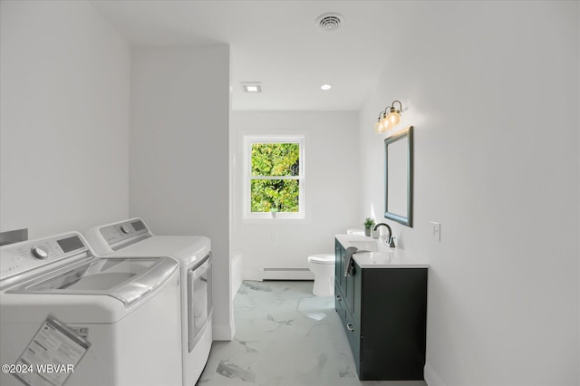 laundry area with separate washer and dryer, sink, and a baseboard radiator