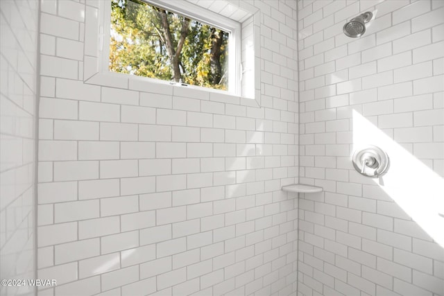 bathroom with a tile shower