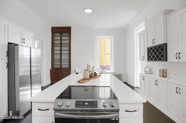 kitchen with white cabinets and appliances with stainless steel finishes