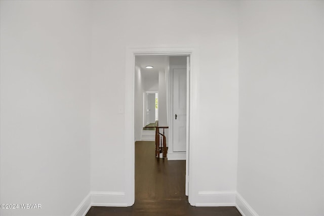 corridor with dark hardwood / wood-style floors