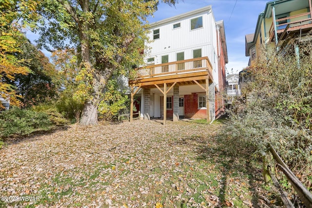 back of property with a wooden deck