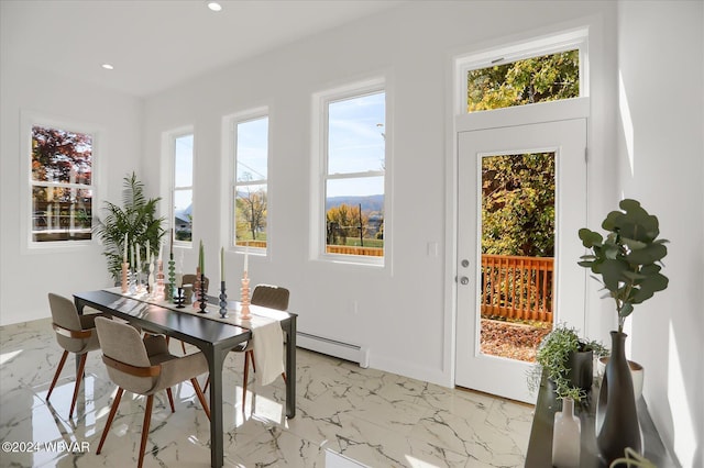 dining area with baseboard heating