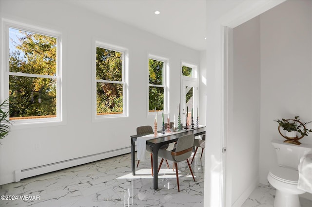 office featuring a baseboard radiator and a healthy amount of sunlight