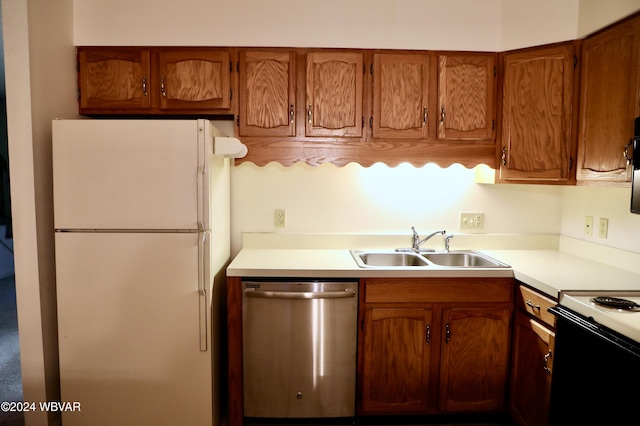 kitchen featuring white appliances and sink