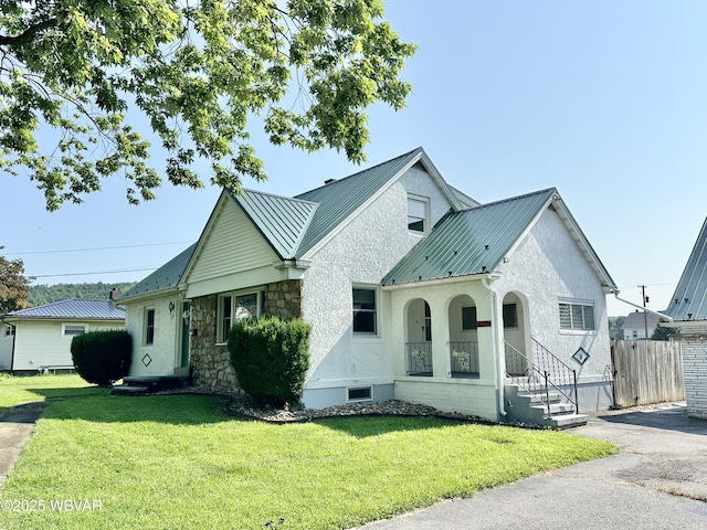 1420 Richards Ave, Williamsport, PA 17701 - view of front of property featuring a metal roof, stone siding, stucco siding, and a standing seam roof