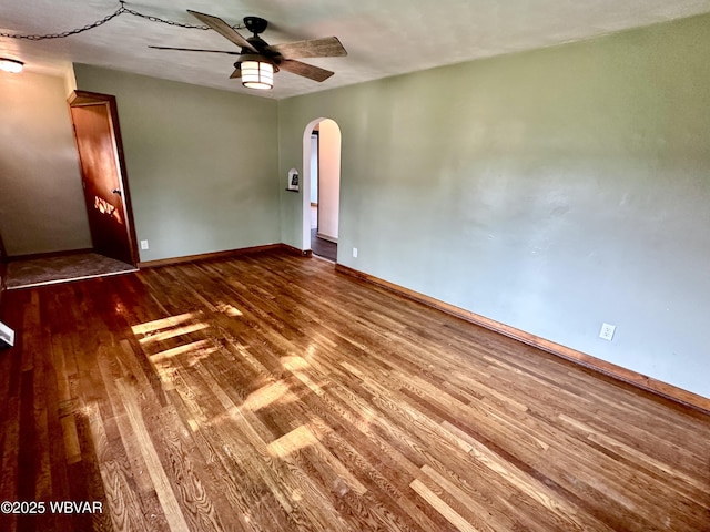 1420 Richards Ave, Williamsport, PA 17701 - spare room featuring wood finished floors, arched walkways, and a ceiling fan