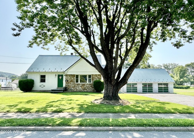 1420 Richards Ave, Williamsport, PA 17701 - view of front of home featuring a metal roof, a front lawn, and stone siding