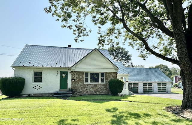 1420 Richards Ave, Williamsport, PA 17701 - view of front of house with a front lawn, a metal roof, driveway, and an attached garage