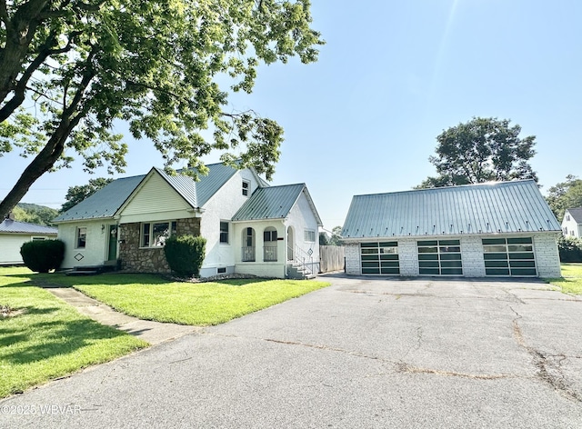 1420 Richards Ave, Williamsport, PA 17701 - view of front of home with a metal roof, a front lawn, and a detached garage