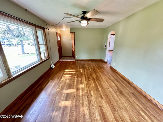 1420 Richards Ave, Williamsport, PA 17701 - spare room with wood finished floors, a ceiling fan, and arched walkways