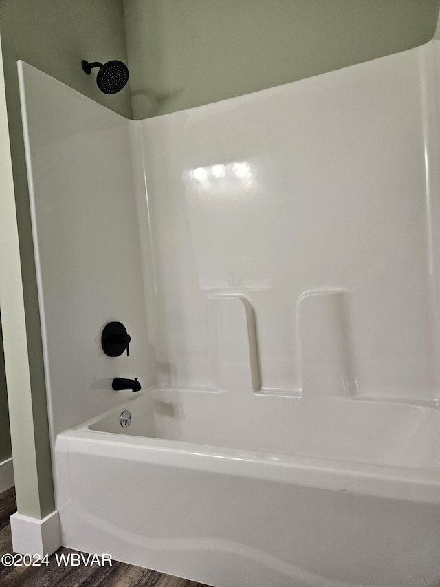 bathroom featuring shower / bath combination and wood-type flooring