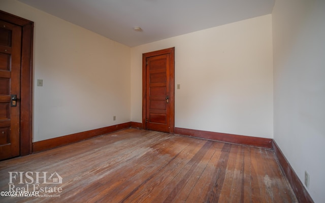 spare room featuring hardwood / wood-style floors