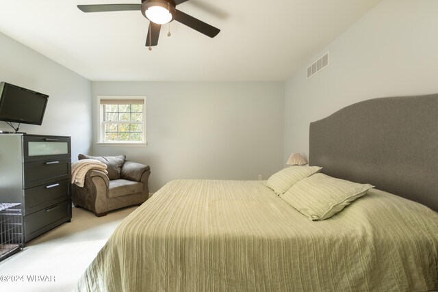 carpeted bedroom with ceiling fan