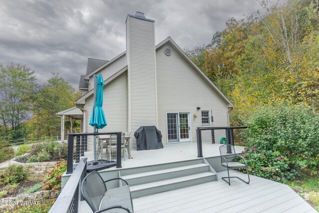 wooden deck with area for grilling