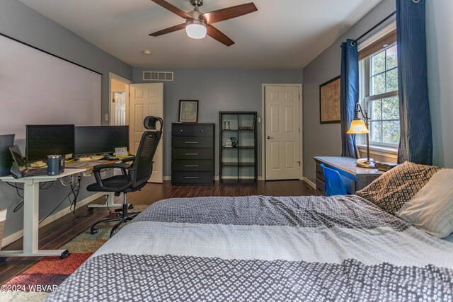 bedroom featuring ceiling fan and dark wood-type flooring