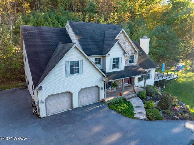 view of front of property featuring a porch and a garage