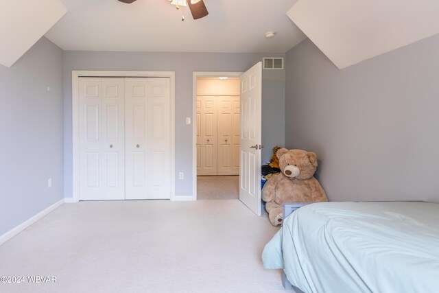 carpeted bedroom with a closet and ceiling fan