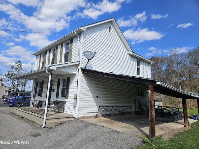 225 Pickwick St, Mill Hall, PA 17751 - view of property exterior featuring a porch and driveway