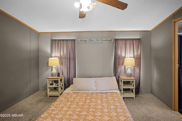 bedroom with carpet floors, crown molding, and ceiling fan
