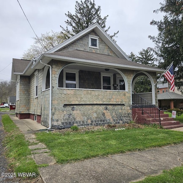 view of front of house with stone siding