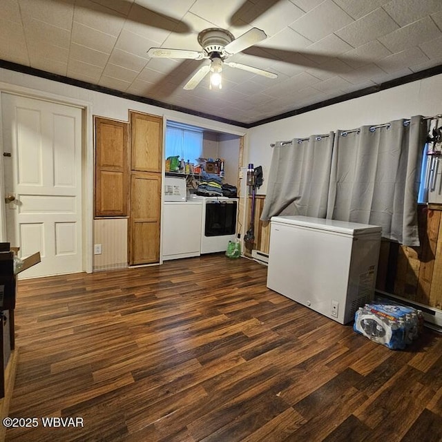 unfurnished living room with dark wood-type flooring and a ceiling fan