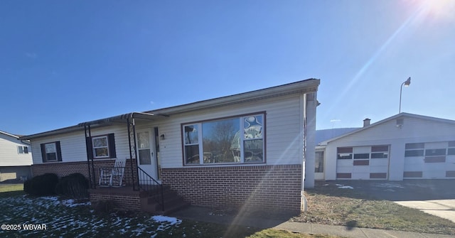 view of front of home with an outbuilding and a garage