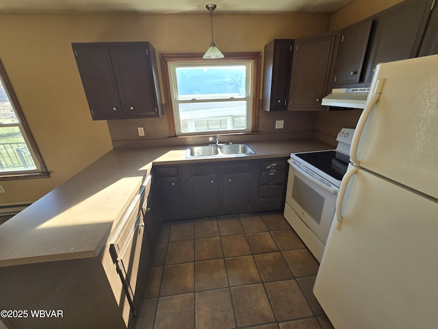 kitchen with dark tile patterned flooring, pendant lighting, sink, white appliances, and dark brown cabinets