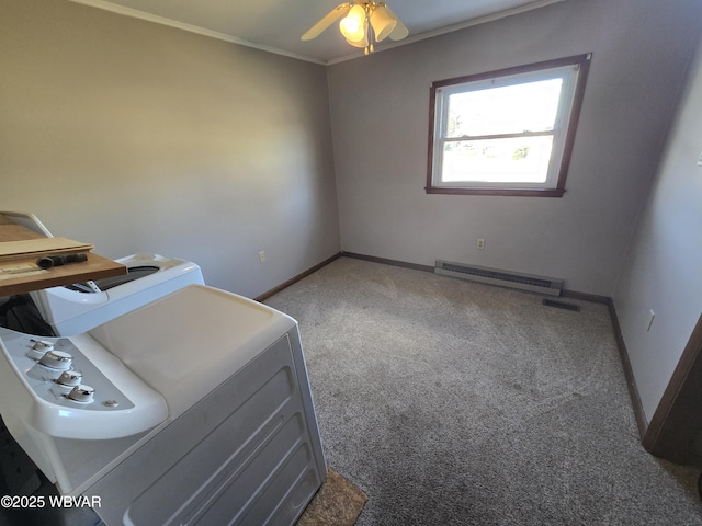 interior space featuring washer / dryer, ceiling fan, carpet floors, a baseboard radiator, and crown molding