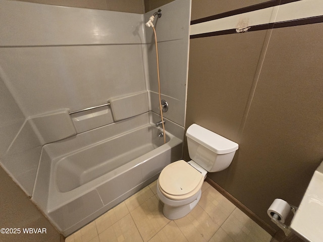 bathroom with shower / bathtub combination, tile patterned floors, and toilet