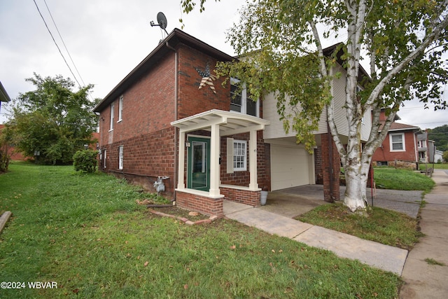 view of front of home with a garage and a front yard