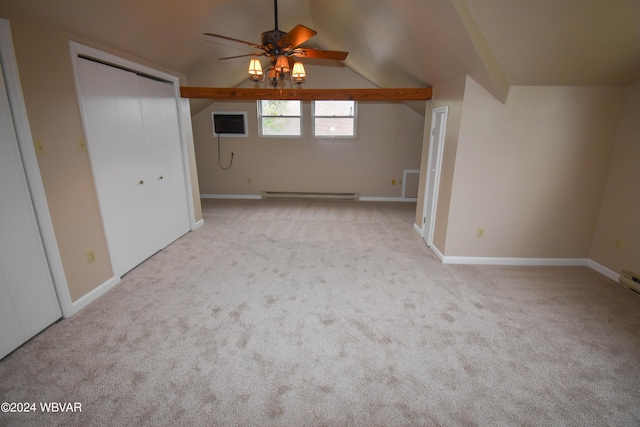 interior space featuring vaulted ceiling, ceiling fan, baseboard heating, a wall mounted AC, and light colored carpet