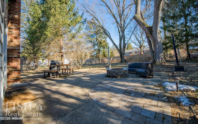 view of patio / terrace featuring an outdoor fire pit