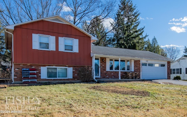 split level home featuring a garage and a front yard