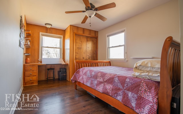 bedroom with ceiling fan, dark hardwood / wood-style floors, and a closet