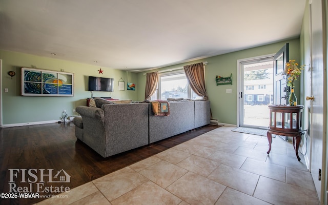 unfurnished living room with plenty of natural light and wood-type flooring