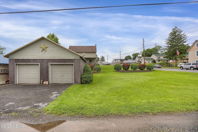 view of front facade with an outbuilding and a front lawn