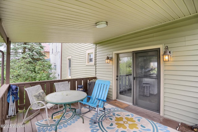 wooden deck with outdoor dining area