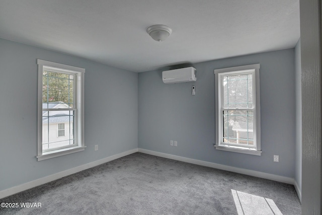 carpeted empty room with baseboards and a wall mounted AC