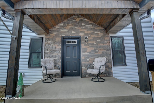 view of exterior entry featuring stone siding