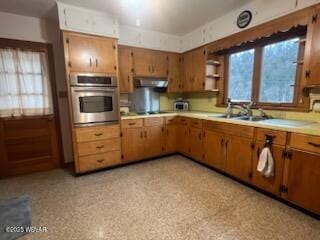 kitchen featuring sink and oven